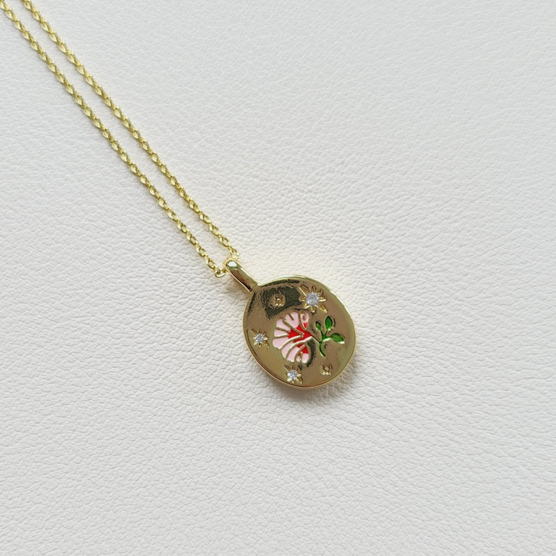 Gold tone enamel rose pendant necklace