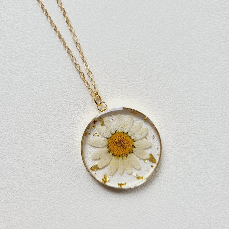 Gold tone dried yellow flower resin pendant necklace