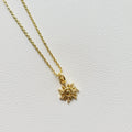 Gold tone sun charm pendant necklace