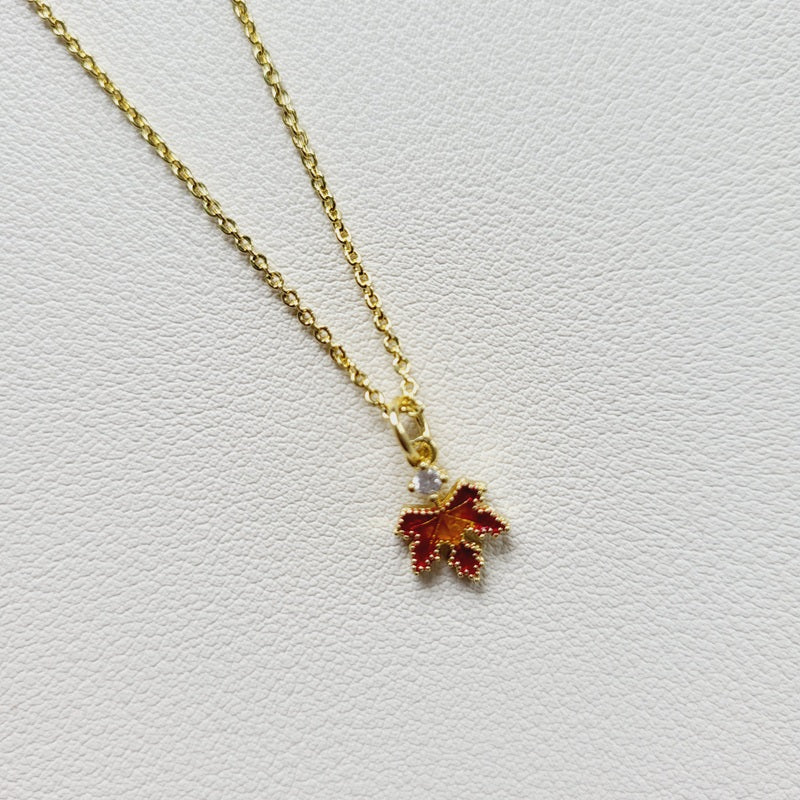 Gold tone amber leaf charm pendant necklace