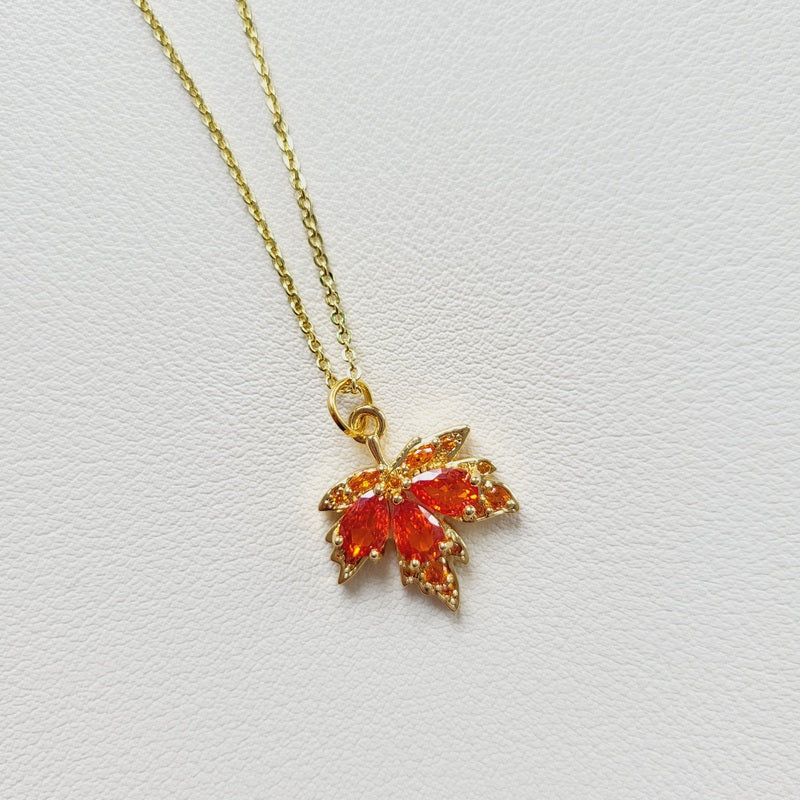 Gold tone amber leaf charm pendant necklace