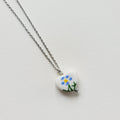 Flower design ceramic white heart charm with silver tone chain necklace (blue)