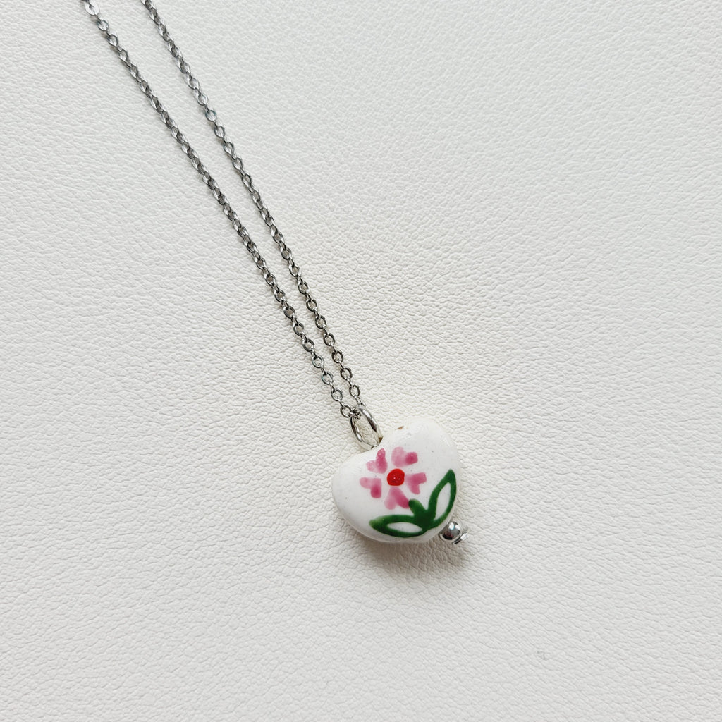 Flower design ceramic white heart charm with silver tone chain necklace (pink)