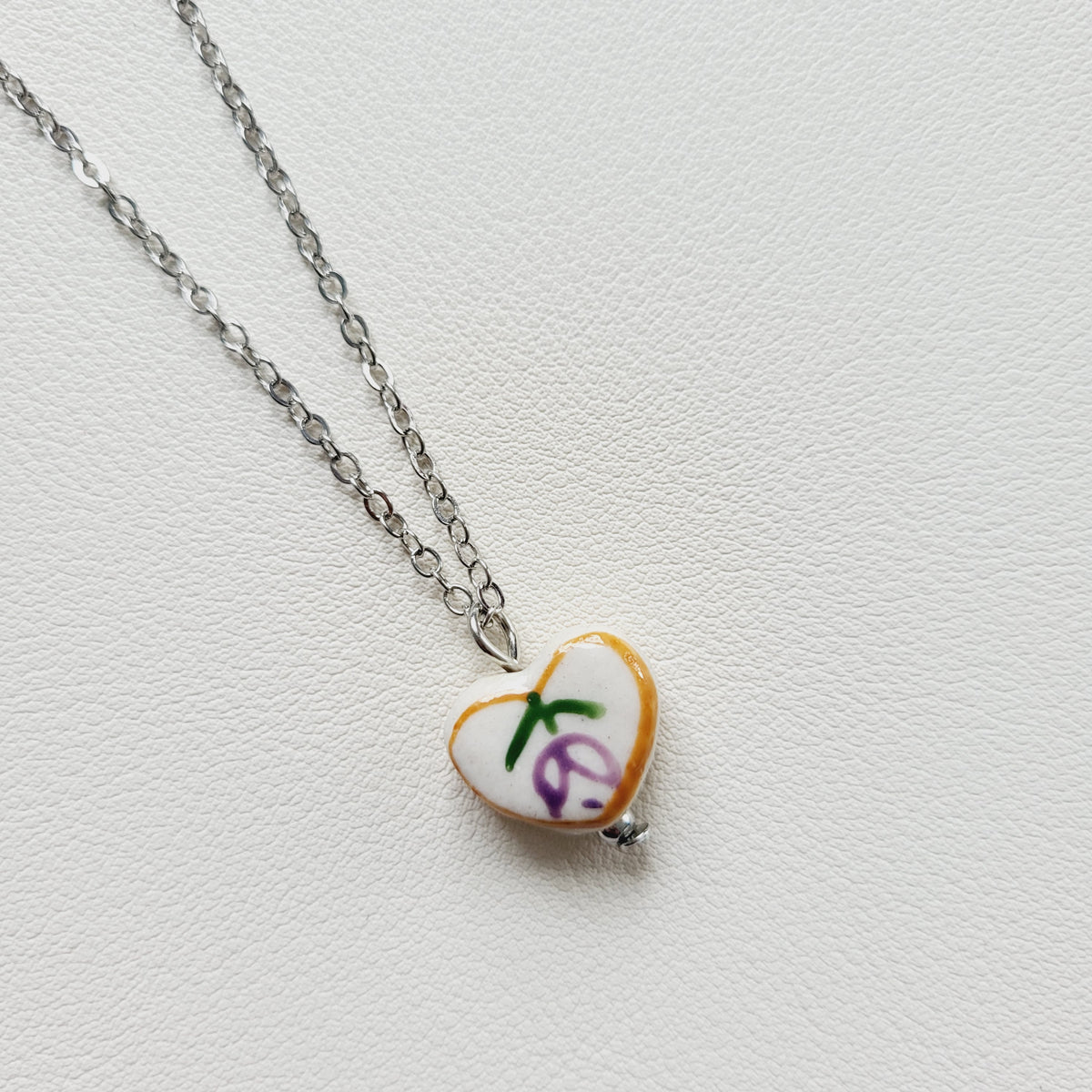 Flower design ceramic white heart charm with silver tone chain necklace (purple)
