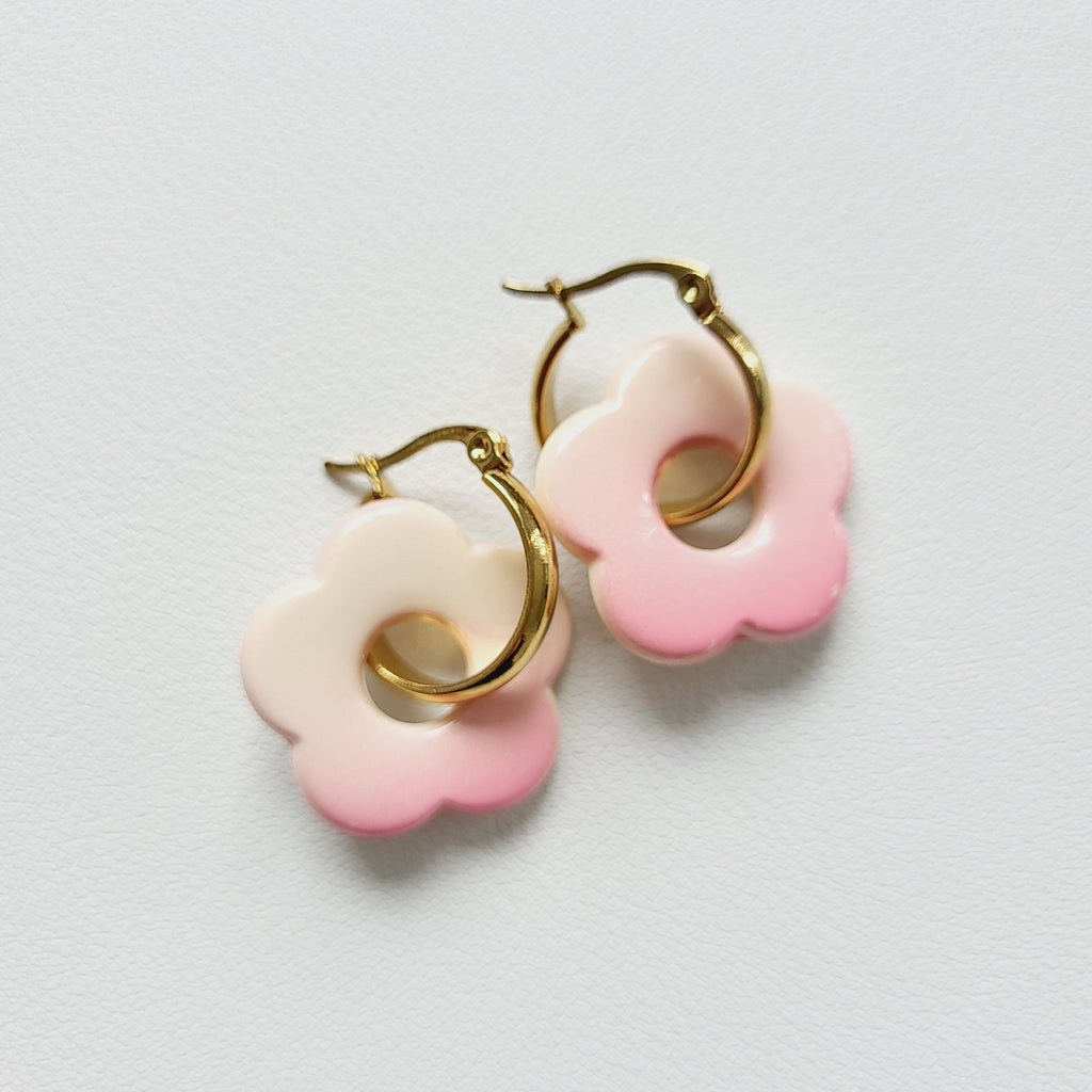 Flower charm gold tone hoop earrings