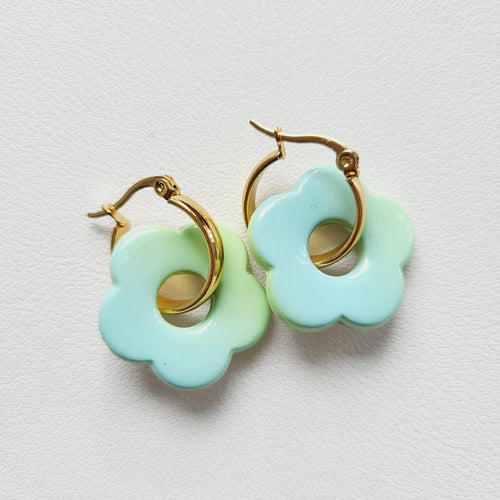 Flower charm gold tone hoop earrings