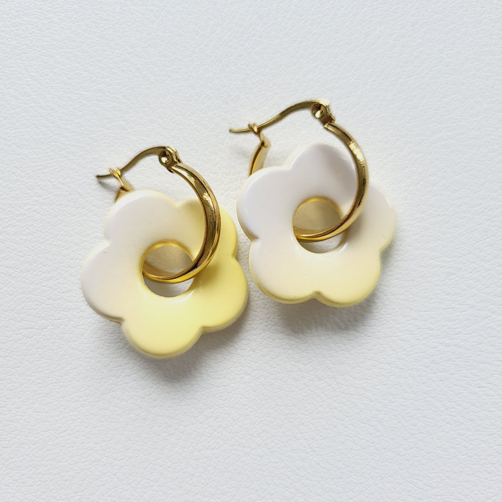Flower charm gold tone hoop earrings