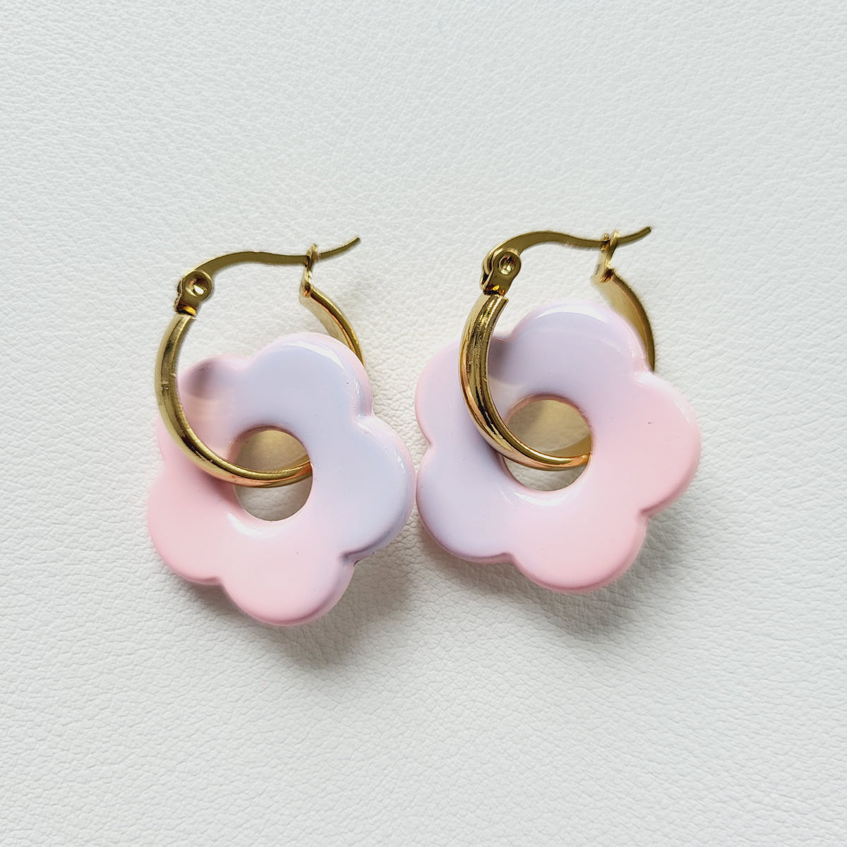 Flower charm gold tone hoop earrings