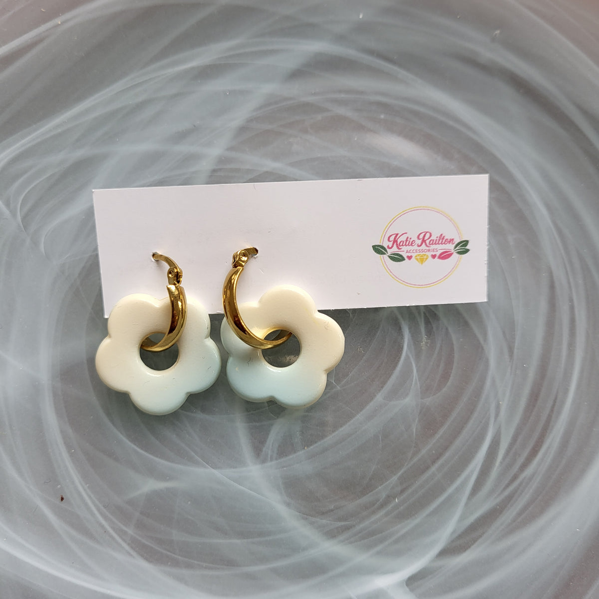 Flower charm gold tone hoop earrings