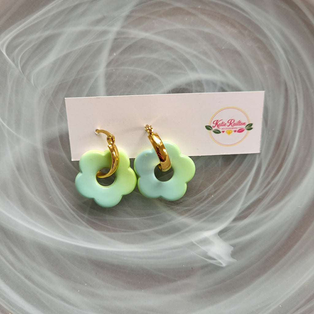 Flower charm gold tone hoop earrings