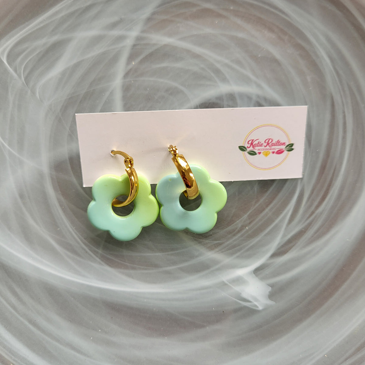 Flower charm gold tone hoop earrings