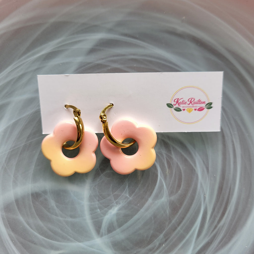Flower charm gold tone hoop earrings