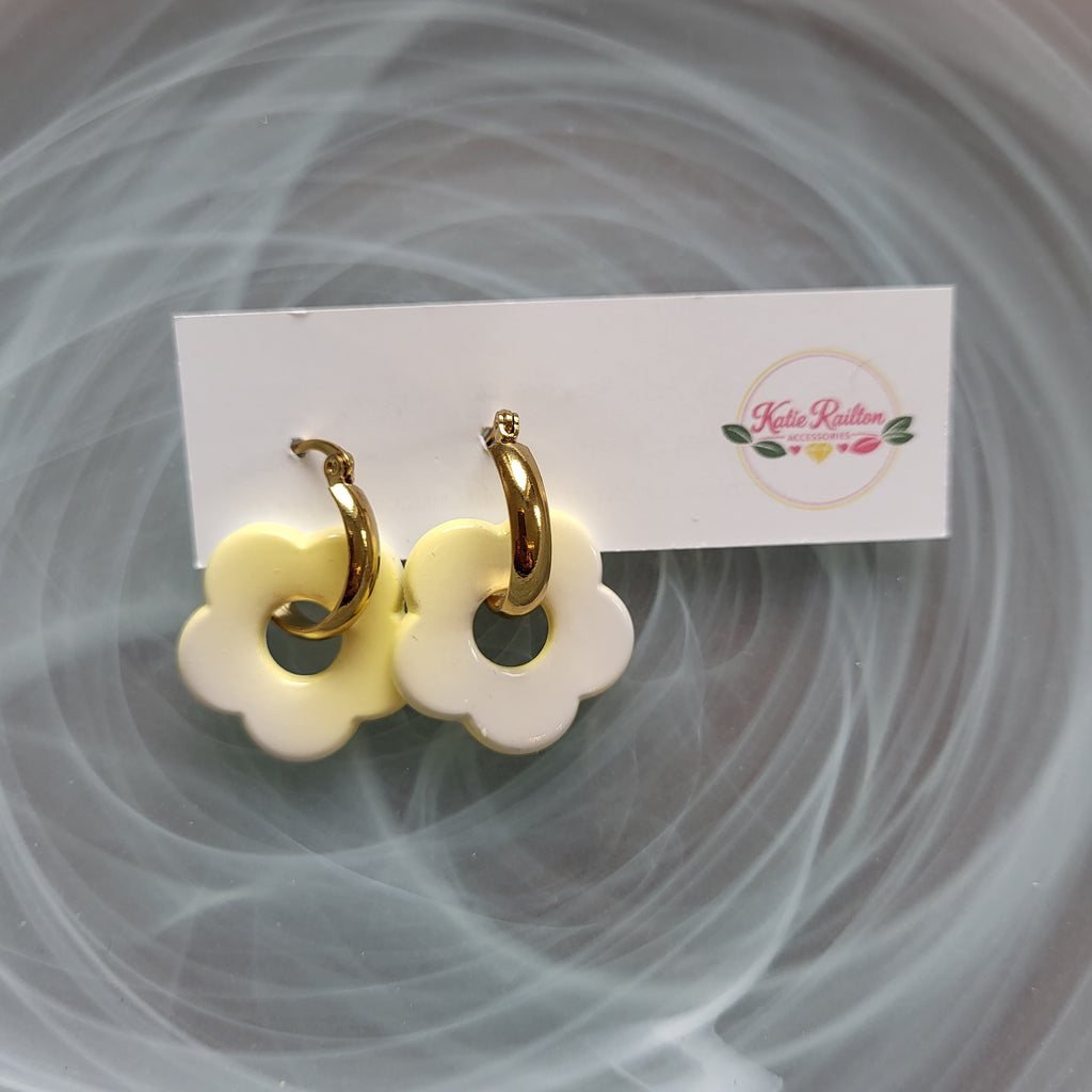 Flower charm gold tone hoop earrings