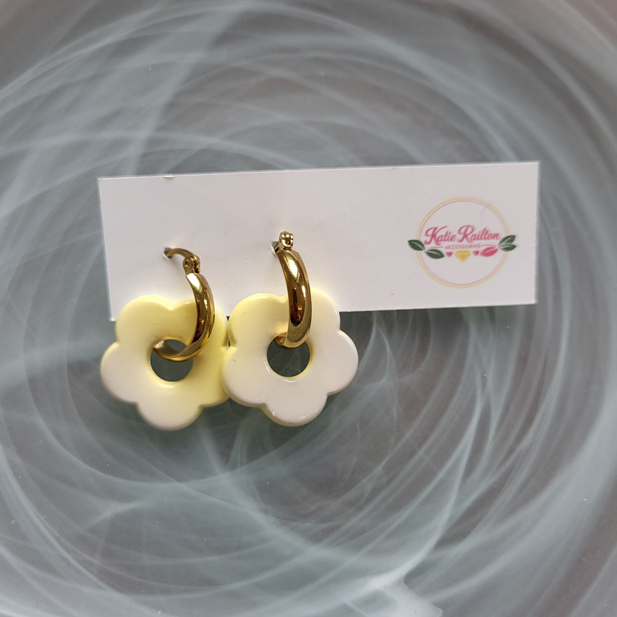Flower charm gold tone hoop earrings