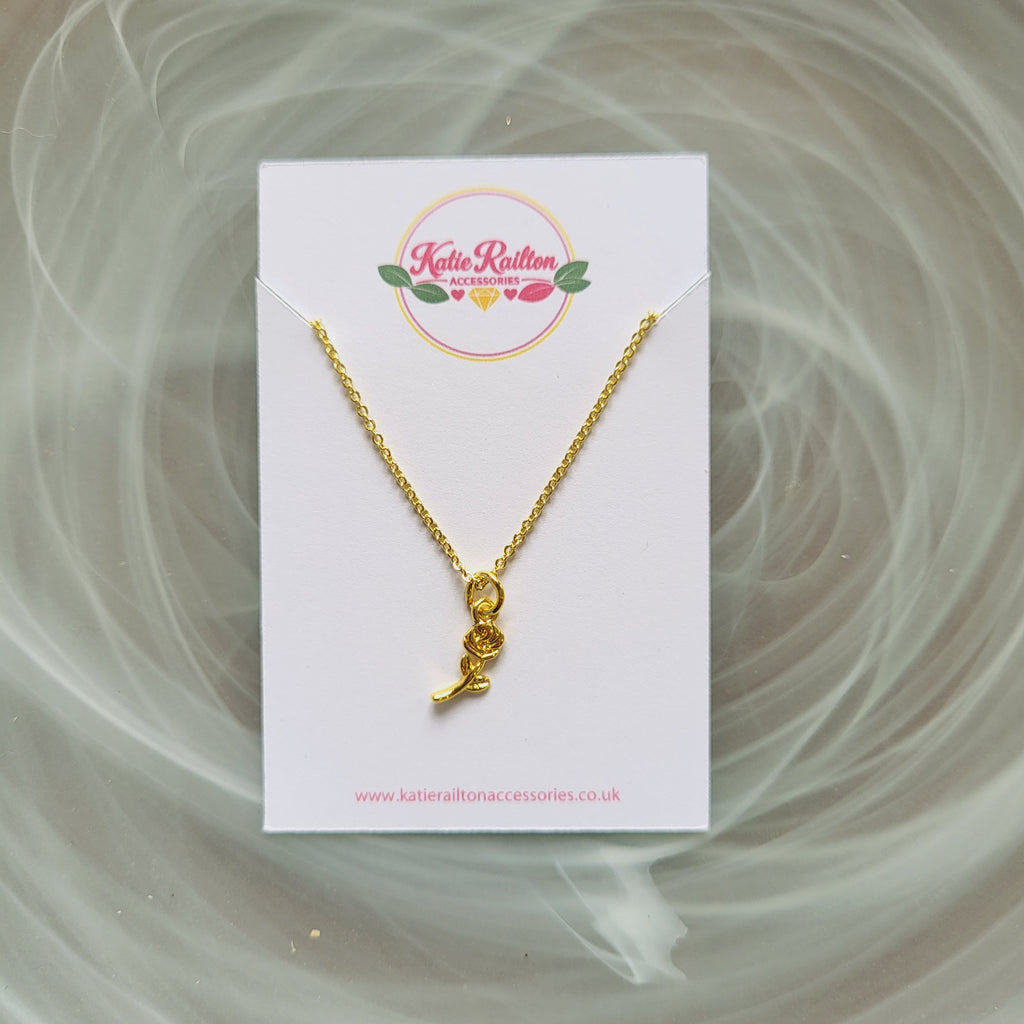 Gold tone rose flower charm necklace