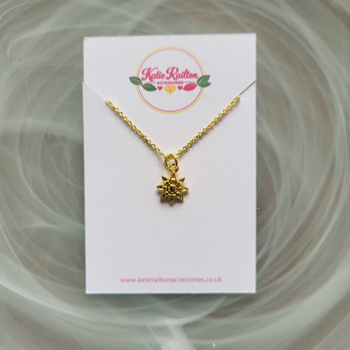 Gold tone sun charm pendant necklace
