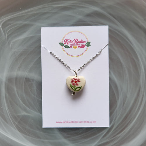 Flower design ceramic white heart charm with silver tone chain necklace (pink)