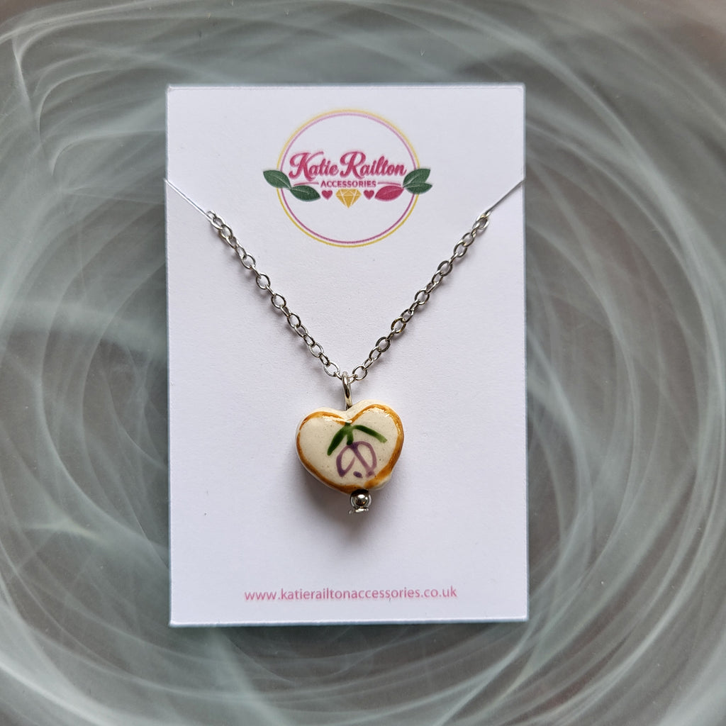 Flower design ceramic white heart charm with silver tone chain necklace (purple)
