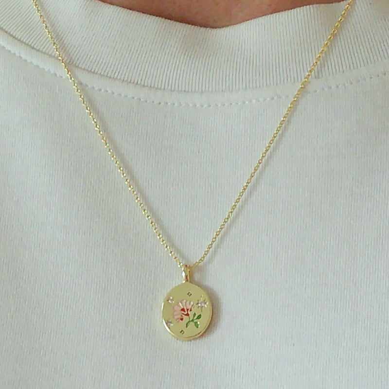 Gold tone enamel rose pendant necklace