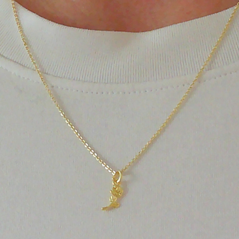 Gold tone rose flower charm necklace