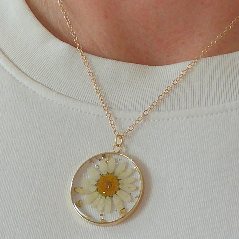 Gold tone dried yellow flower resin pendant necklace